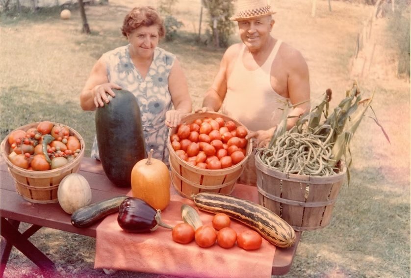 Tom's grandparents displaying vegetables from their garden